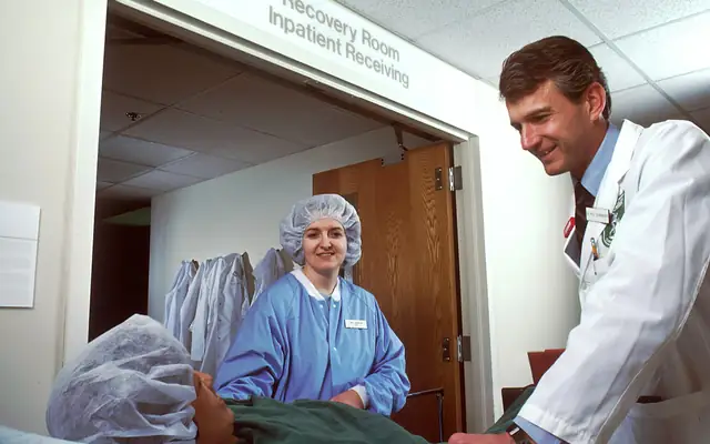 Hospital staff in scrubs and lab coats